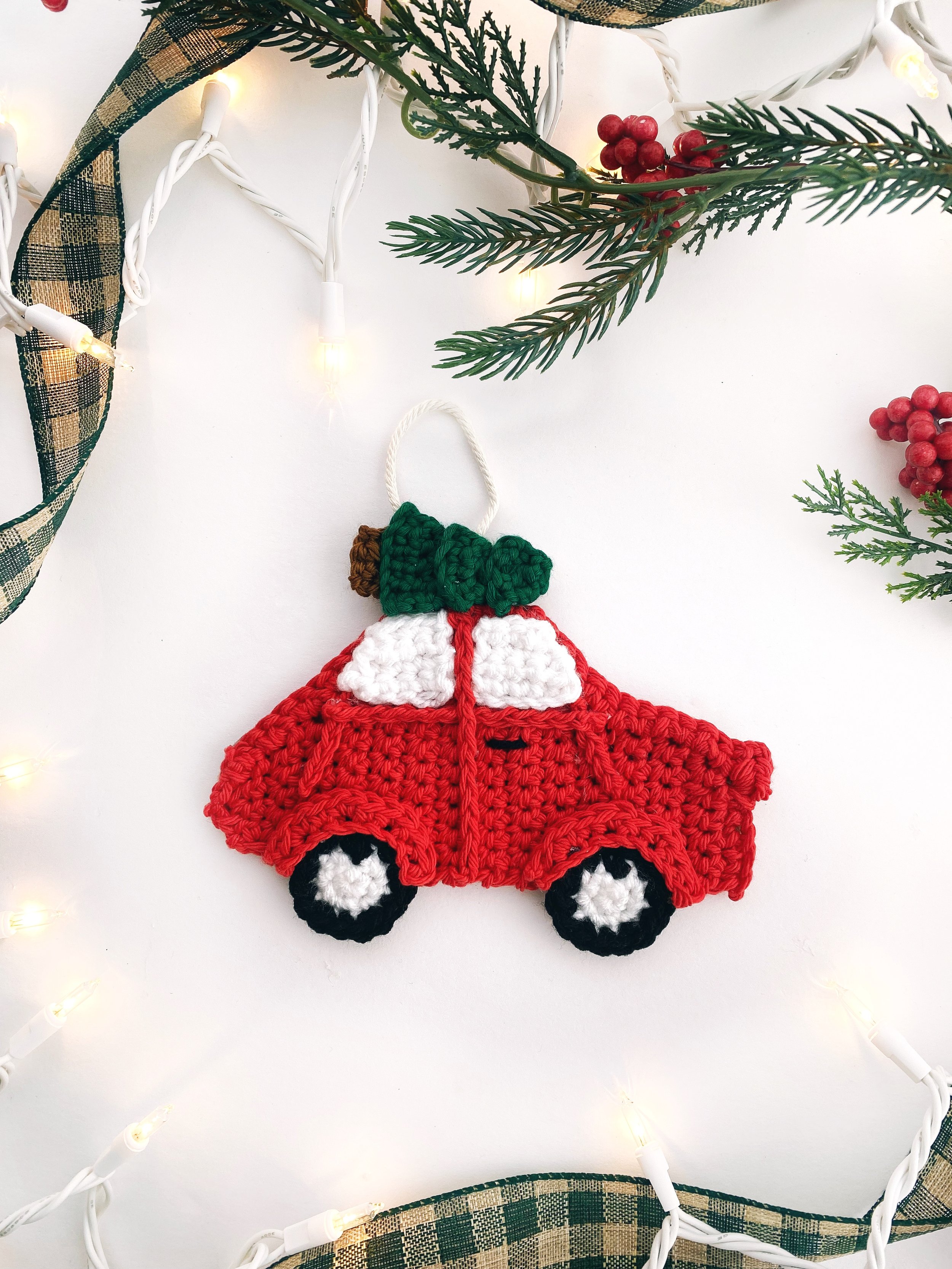 Crochet red car with christmas tree